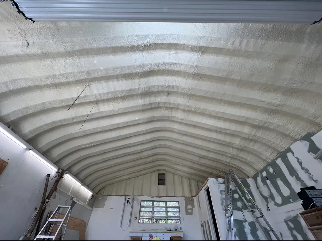 Spray polyurethane foam applied to the underside of a metal roof deck in Bountiful
